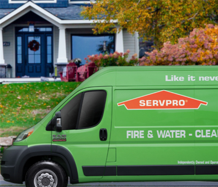 SERVPRO emergency response van in front of house