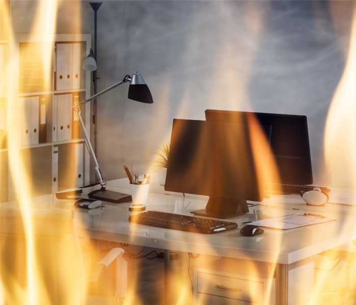 computer on fire in office due to a fire hazard