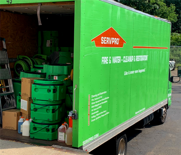 photo of a green SERVPRO truck full of SERVPRO equipment